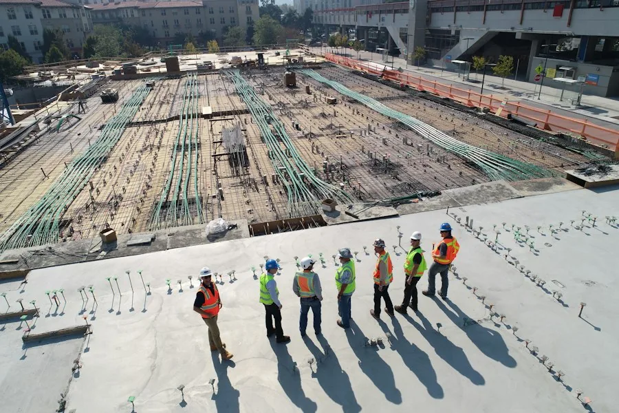 Crew inspecting a large foundation slab