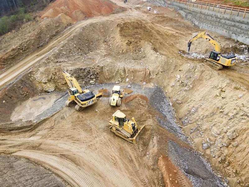 Excavators preparing a building site